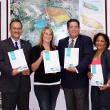 The moment the Free Zone Team presents Minister de Meza its new general information investment brochure.